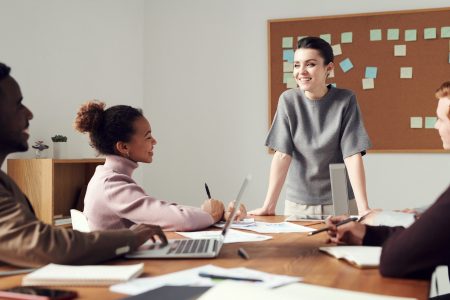 Image of woman leading a team in a meeting
